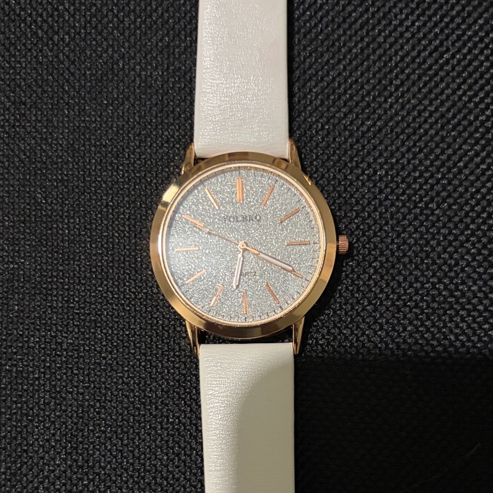 Elegant Rose Gold and White Women's Watch

Needs new battery